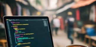 How to Build a Mobile App from Scratch Step-by-Step Cluttered Bangalore desk with laptop, chai mug, market view.